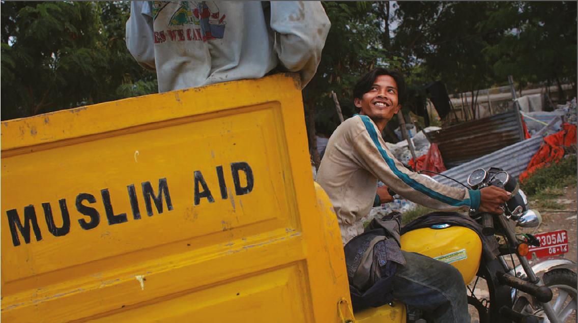Image of motorbike pulling a cart of "Muslim Aid" used in the Communication Challenge article